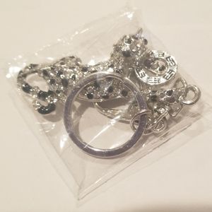 Silver and black unopened EFFY leopard keychain